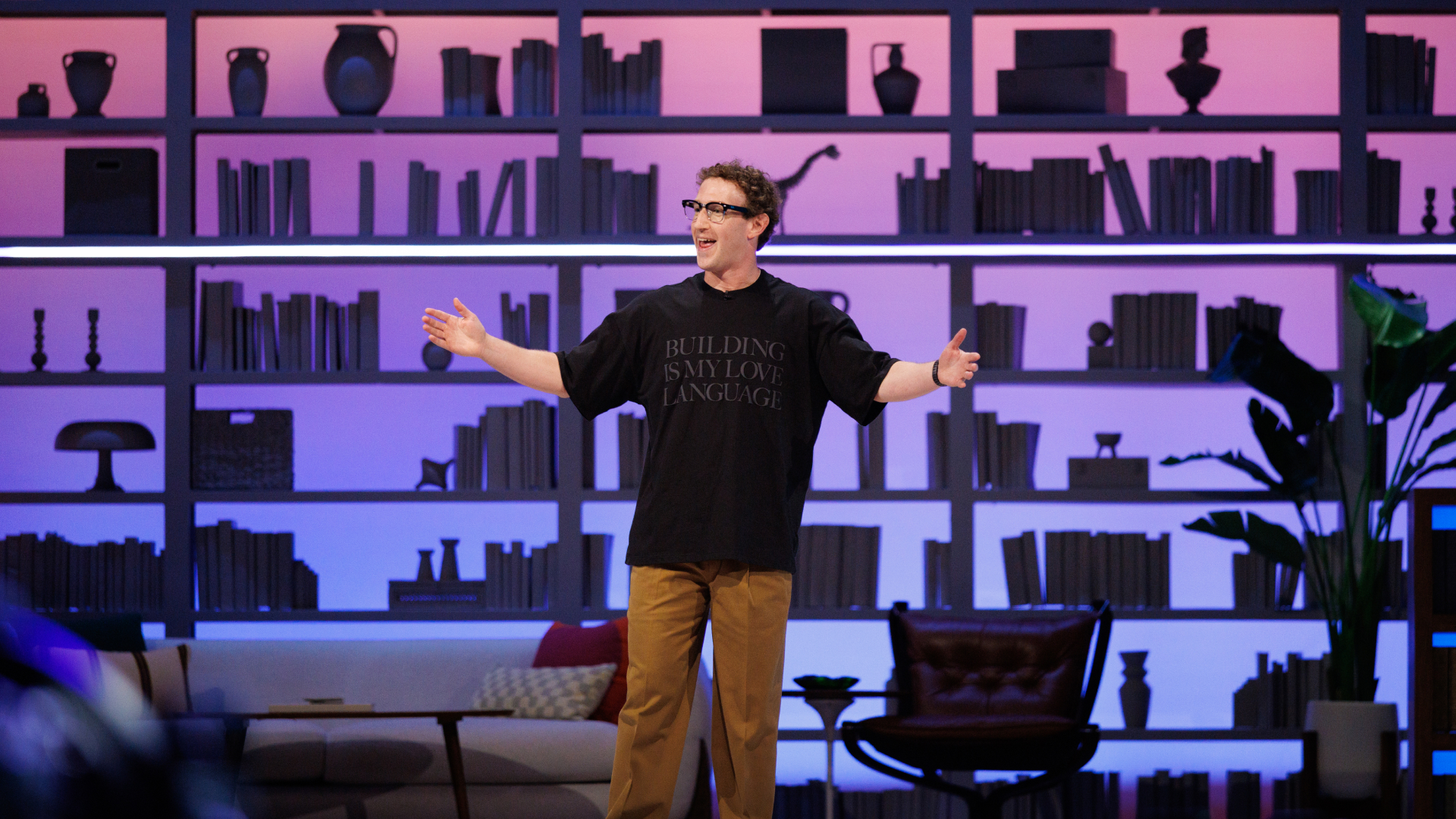 Mark Zuckerberg on stage at Meta Connect 2026 with arms spread in front of a lit bookshelf backdrop